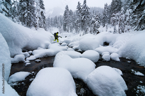 Skier crossing the river