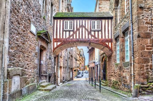 Wooden brigde between two buildigs on narrow street in Saint-Malo, Brittany, France