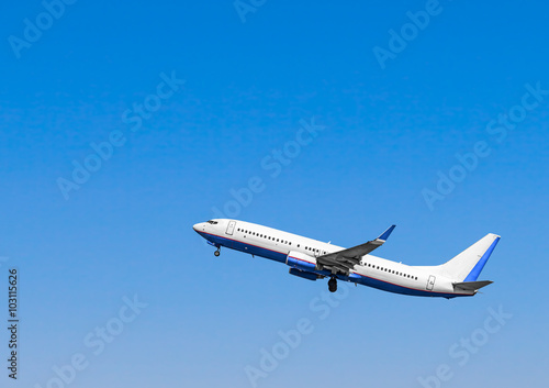 Plane at takeoff, the plane in the blue sky