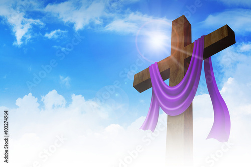 A cross with purple sash on clouds background