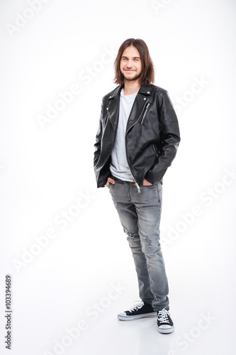 Smiling young man with long hair in black leather jacket