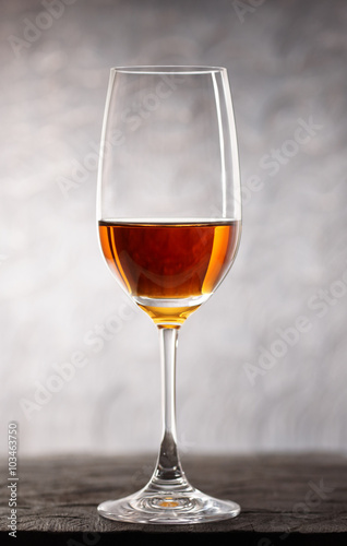 Glass of amontilliado sherry on wooden plank
