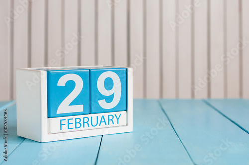 February 29th. Cube calendar for february 29 on wooden surface with empty space For text. Leap year, intercalary day