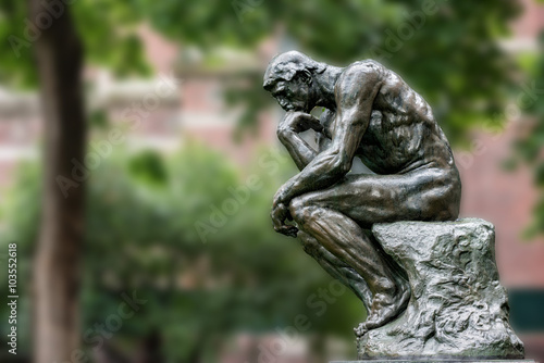 Thinker copper statue at university philosophy building