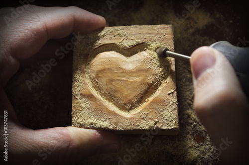 carving wood in heart shape