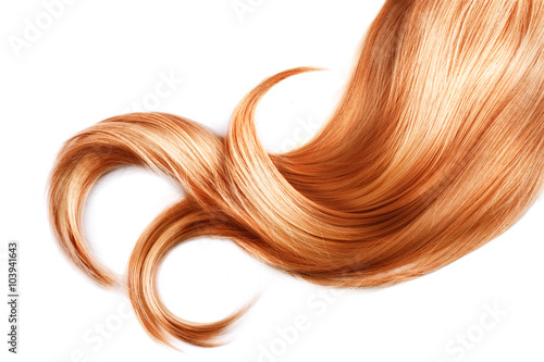 Lock of red hair closeup isolated over white background