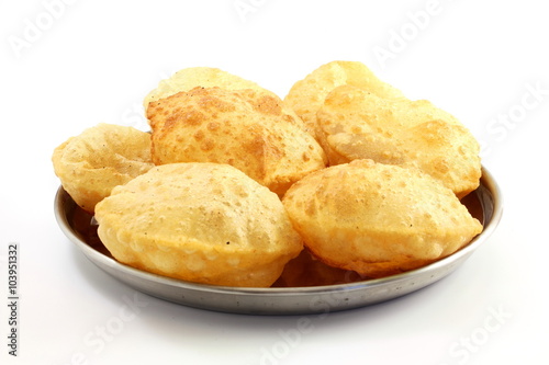 puri or Poori traditional indian homemade deep fried bread or chapati