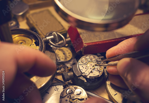 Watchmakers Craftmanship. A watch maker repairing a vintage automatic watch.