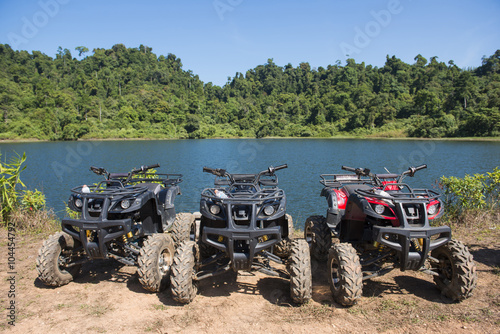 ATVs car parked lakeside
