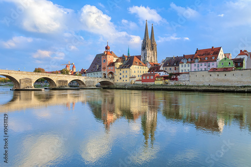 View from Danube on Regensburg Cathedral and Stone Bridge in Regensburg, Germany