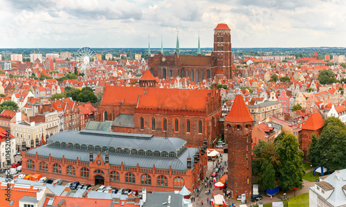 Aerial view of the Saint Mary Church, Market Hall and Tower Jacek in the cloudy summer morning, Gdansk, Poland
