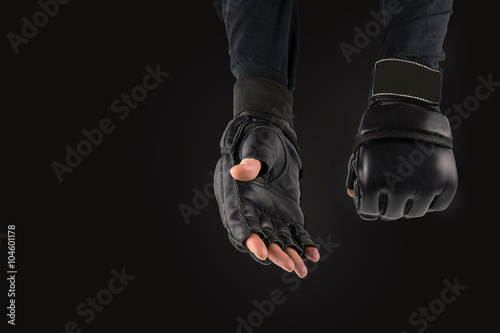 fighter's hand in gloves for martial arts, greeting. space for t