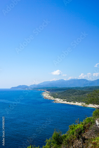 crystal clear sea with the meandering coastline and tropical landscape