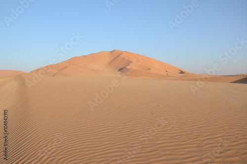 Sand ripples and sand dune hill Oman desert