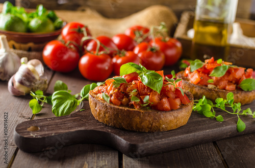 Italian bruschetta with roasted tomatoes and garlic