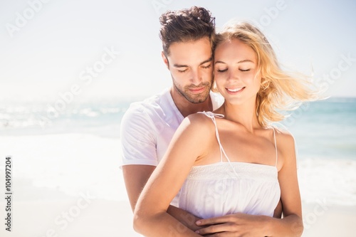 Smiling young couple hugging 