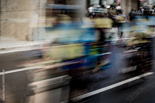 bicycle race , group of people on bikes - motion blur abstract