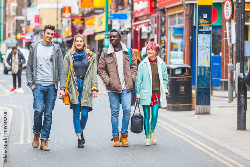 Group of young friends walking in London