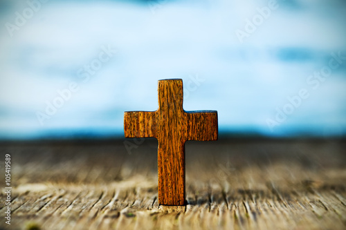 christian cross on a wooden surface