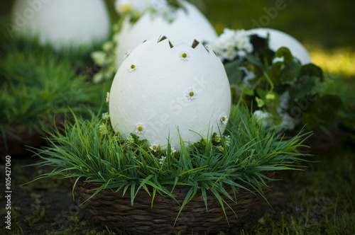 wicker basket with white large decorative egg.