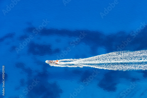 Aerial view of speed boat in azure sea