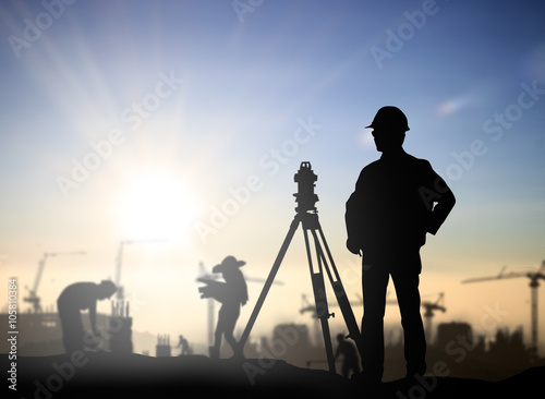 Silhouette Successful male engineer standing survey work on cons