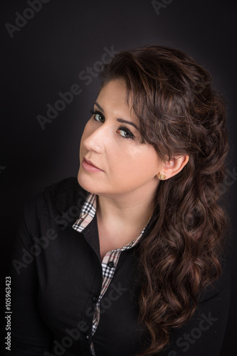 portrait of a young woman on a black background 