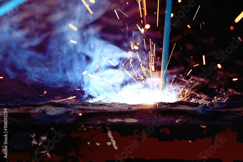 Welder working metal spark