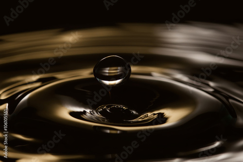 Rings waves in dark splashing background. macro view, soft focus, shallow depth of field. copy space