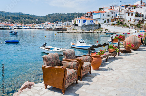 Two armchairs on the waterfront in small town Kokkari on the aegean island Samos