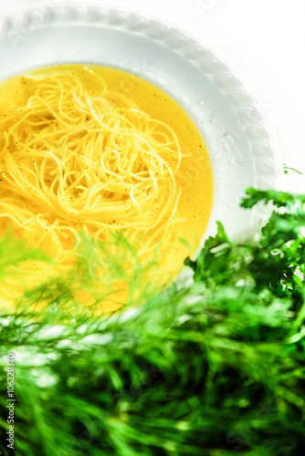 Chicken broth soup with noodles.