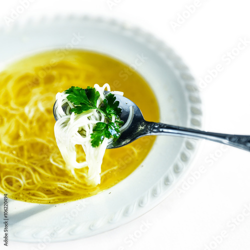 Chicken broth soup with noodles.