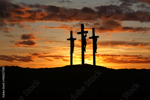 Three crosses over bright sunset with copy space