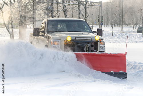 car pickup cleaned from snow by a snowplough during wintertime