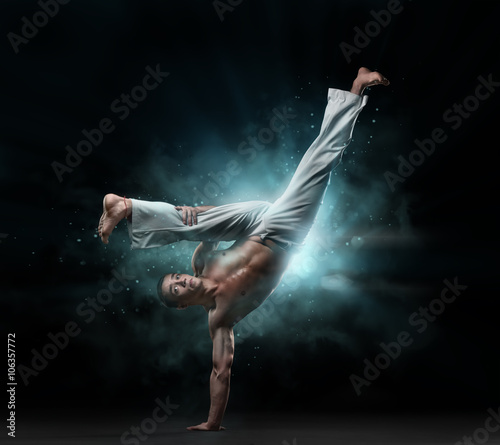 male fighter trains capoeira