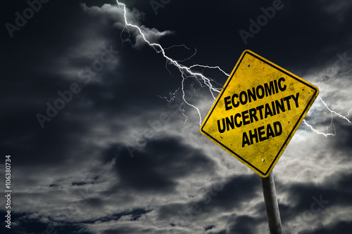 Economic Uncertainty Sign With Stormy Background and Copy Space