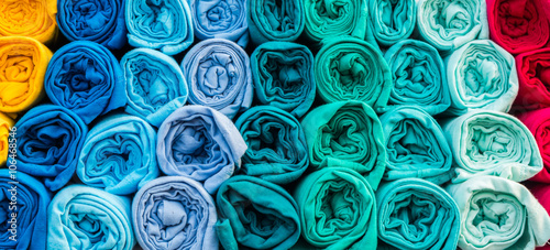 Row of variety multicolored casual shirts.