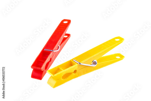 Two color clothes-pegs over white