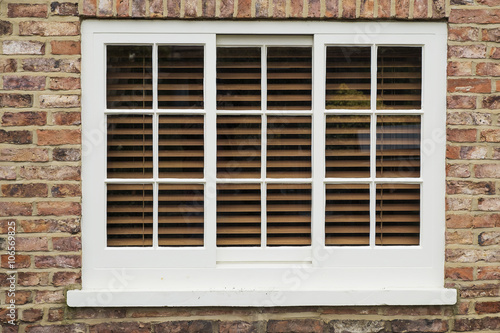 wooden sash window in a brick wall