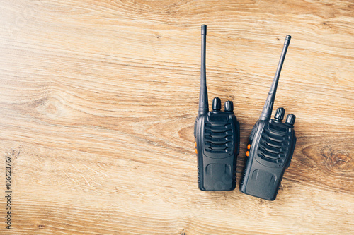 portable radios Walkie-talkie on wooden background