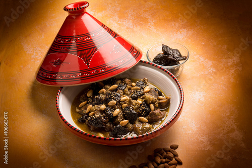 tajine with meat plum almond and sesame seeds