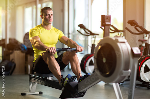 Sporty man exercising in gym