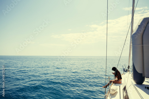 girl yachting with smartphone photograph cruise
