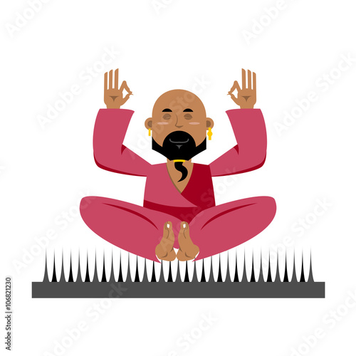 Yogi on nails. Indian yogi sits on spike. nirvana Meditation Yog