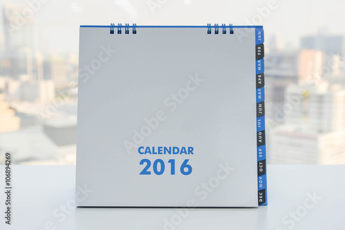 Calendar of 2016 on the white table with city view background