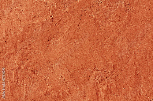 Abstract orange plaster wall texture.