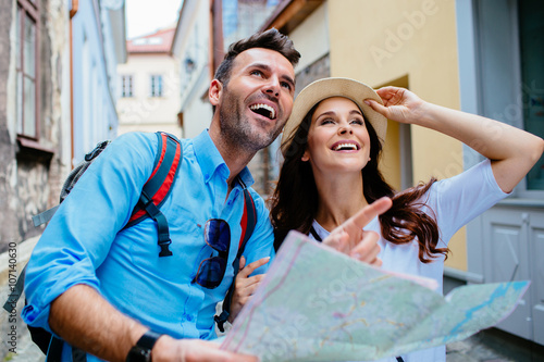 Young happy couple on a sightseeing tour in Europe