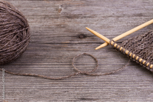 brown knitting and wool yarn