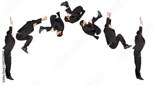 businessman somersault isolated on white