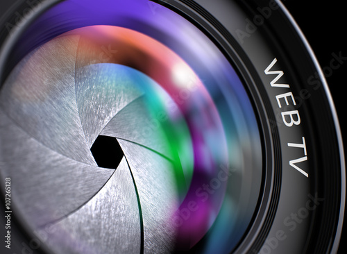 Lens of Digital Camera with Bright Colored Flares. Web Tv Concept. Web Tv - Text on Front of Camera Lens with Light of Reflection. Closeup View. 3D Render.